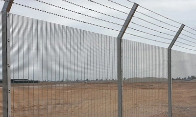 safety check and finishing touches of razor wire